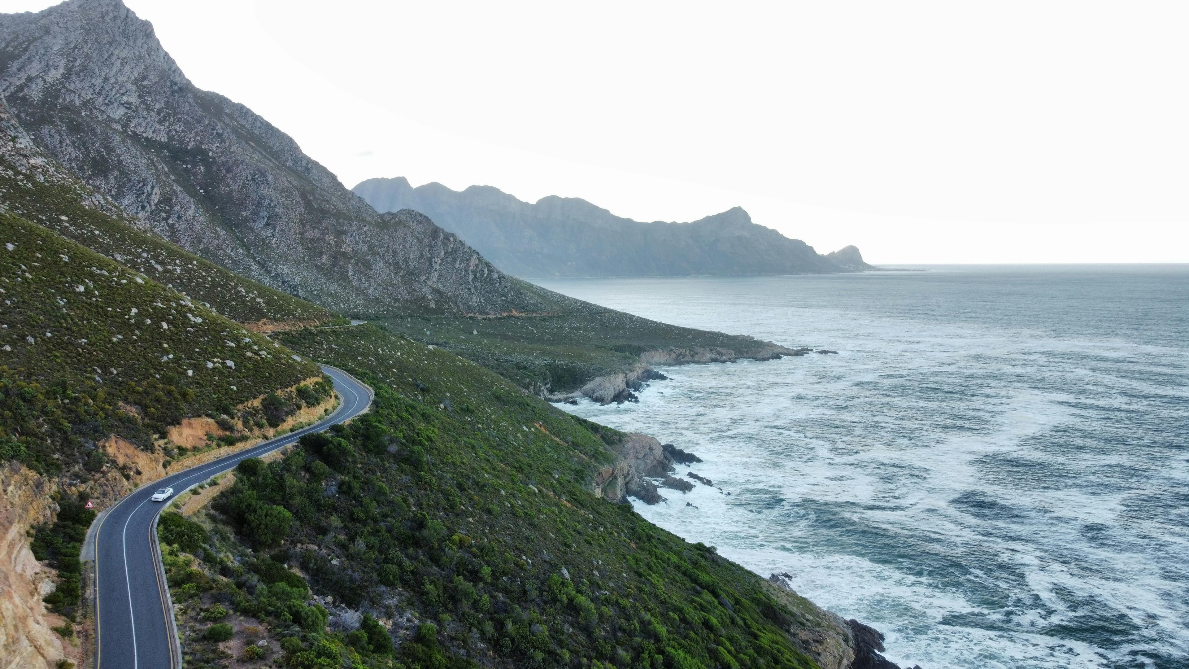 Classic car on a coastal mountain road